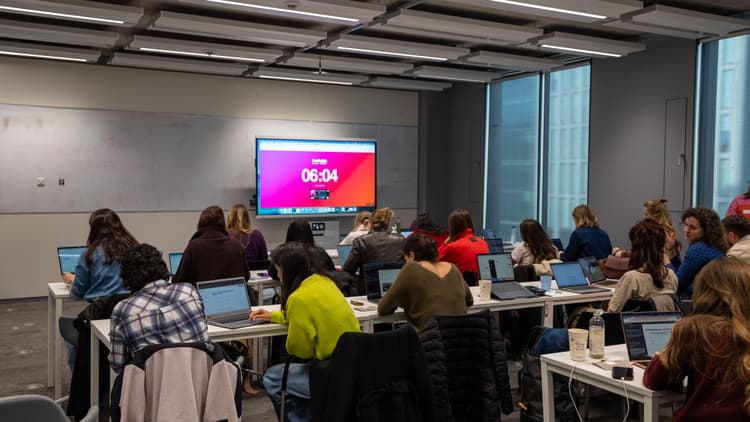 Women coding at Lovable SheBuilds event